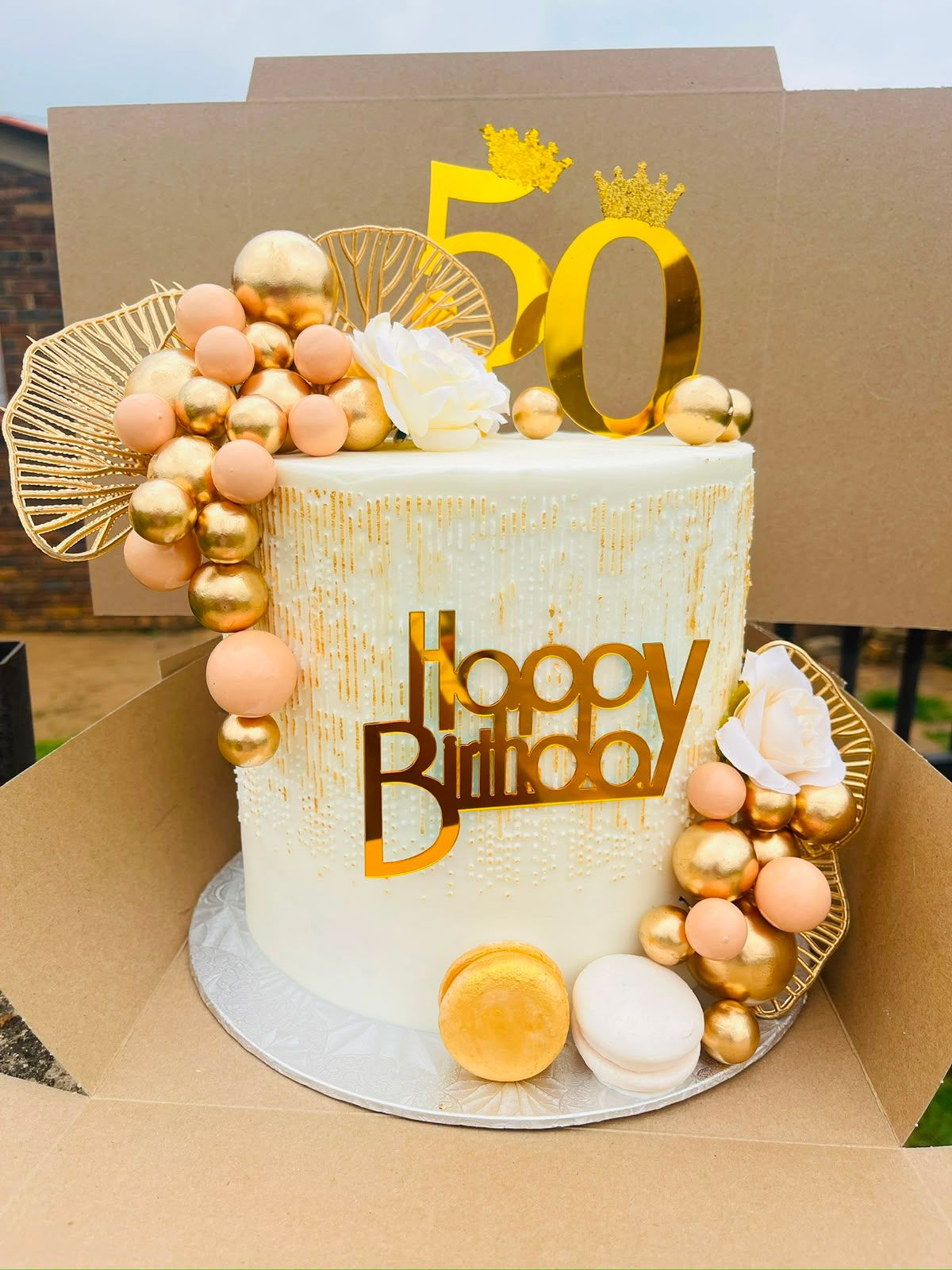 Ivory & Gold 50th Cake by Baked by Buhlebenkosi