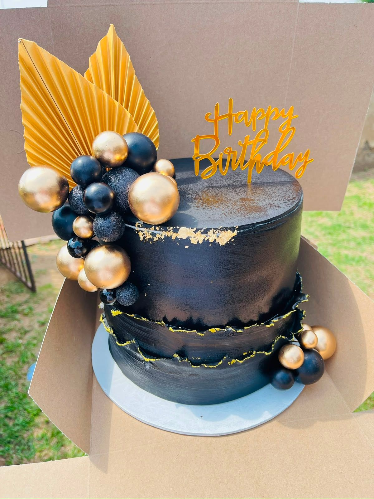 Black & Gold Drama Cake by Baked by Buhlebenkosi
