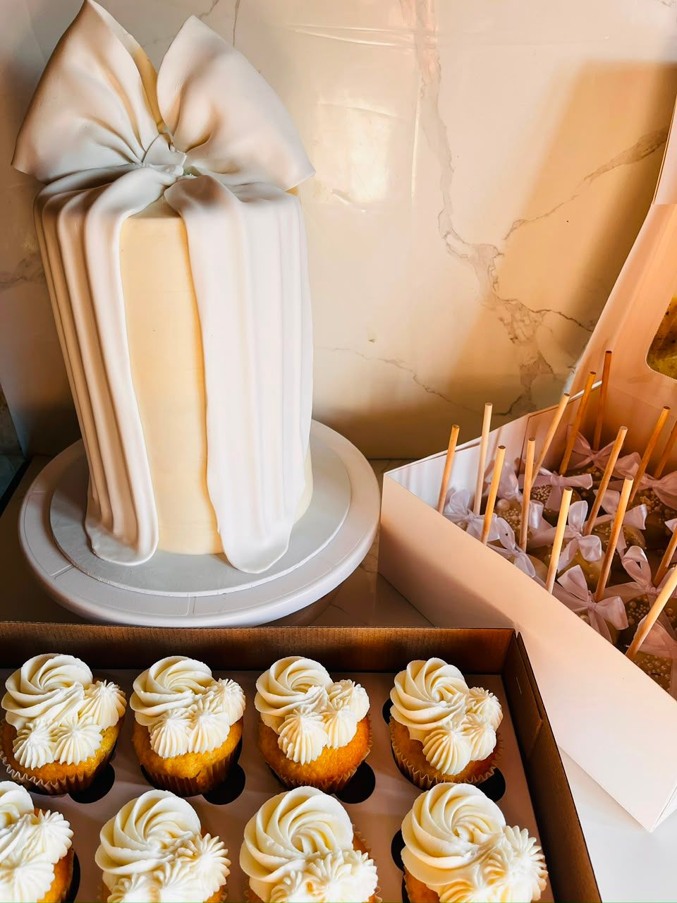White Bow Celebration Cake by Baked by Buhlebenkosi